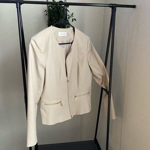 Calvin Klein cream blazer with gold details.